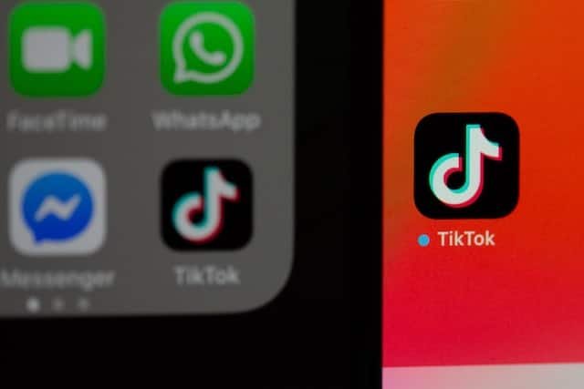 A photo of app icons on a mobile phone with TikTok in sharp focus. Transgender Pakistanis are more visible than ever, especially women. But viral TikTok videos don't equate to real power.